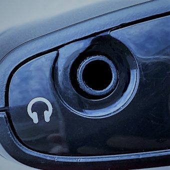 close up of headphone jack with symbol