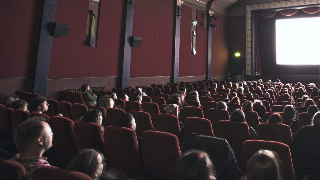 movie theater audience where people need movie theater accessibility