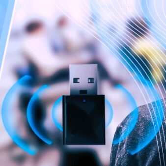 black dongle USB device with sound waves emanating from it